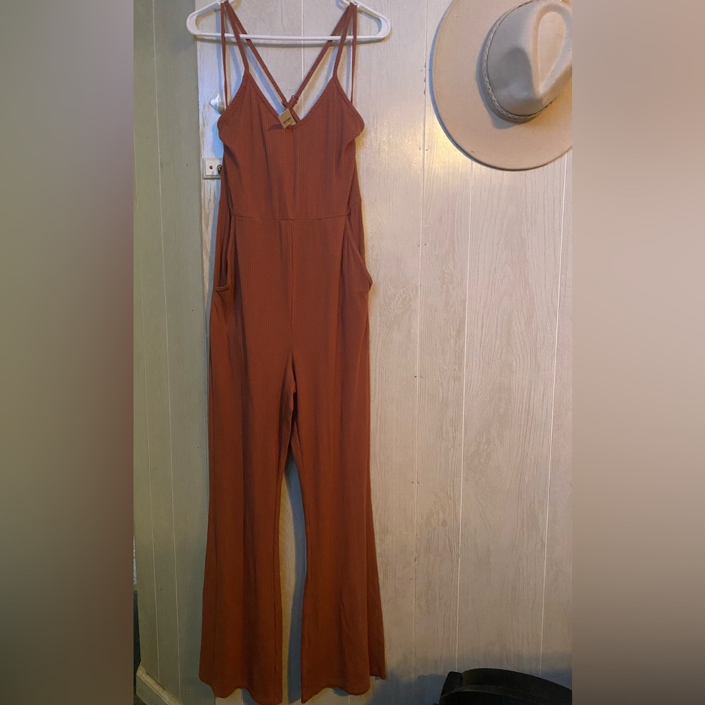 NWT Aerie/American eagle stretch pant romper. Pockets and cross back.